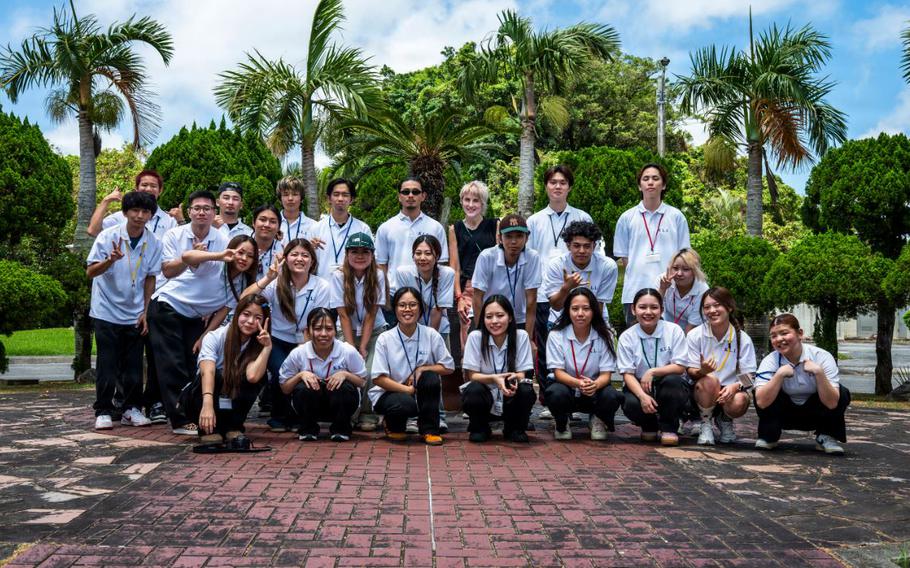Kadena Language Institute students and teachers pose for a photo at the Ryukyu Islands Surrender Site during a tour at Kadena Air Base, Japan.